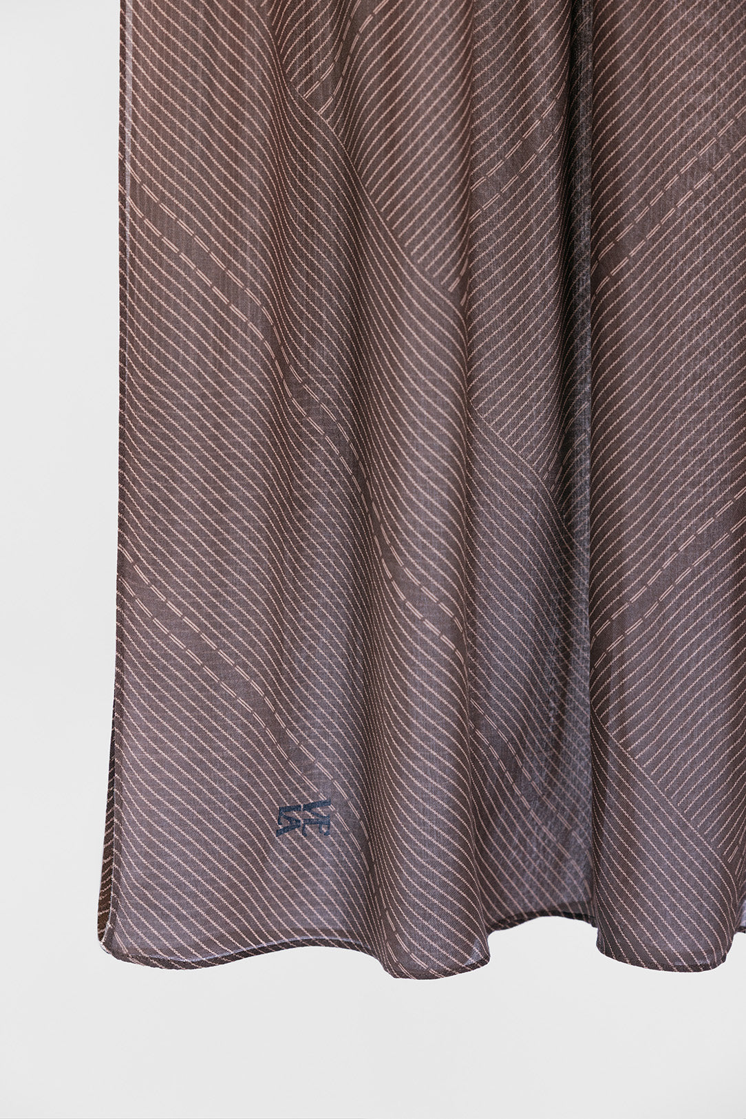 striped brown fabric with a subtle pattern on a white background