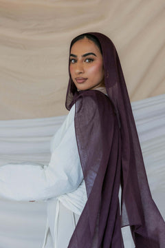 Model wearing soft modal hijab with a rich, layered tone and smooth drape.

